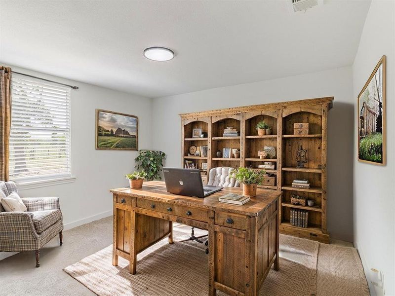 Office area with light carpet and baseboards Office area with light carpet and baseboards