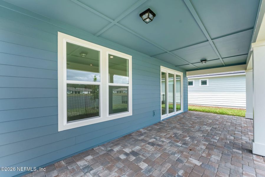 Exterior details and patio area of a home in Del Webb Wildlight, Wildlight (Image 3).