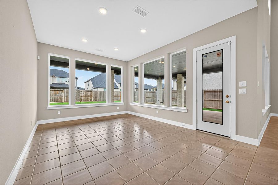 Walls of windows in the dining area with plenty of room for an oversized table.