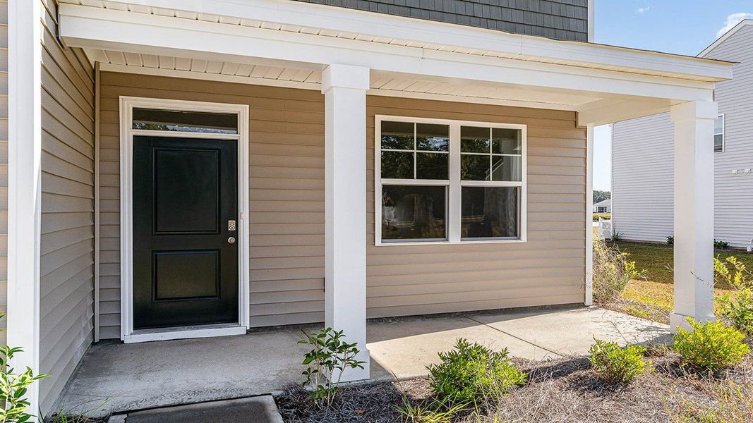 Front exterior of a new home in Auberon Woods, Conway, SC, highlighting curb appeal (Image 11).