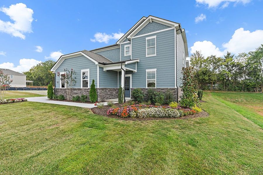 A house with a large front yard. A house with a large front yard.