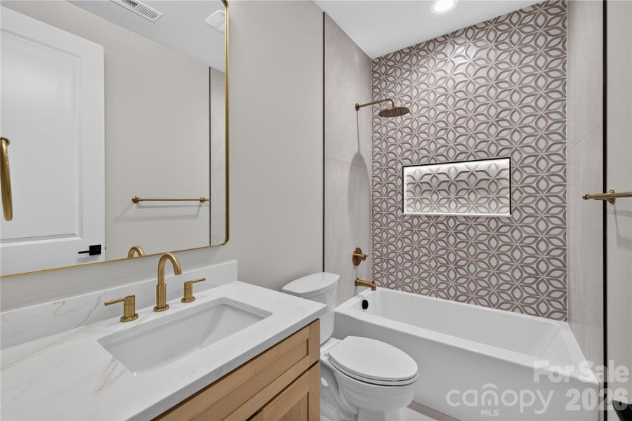 Hall bath with yes, another illuminated shower niche!