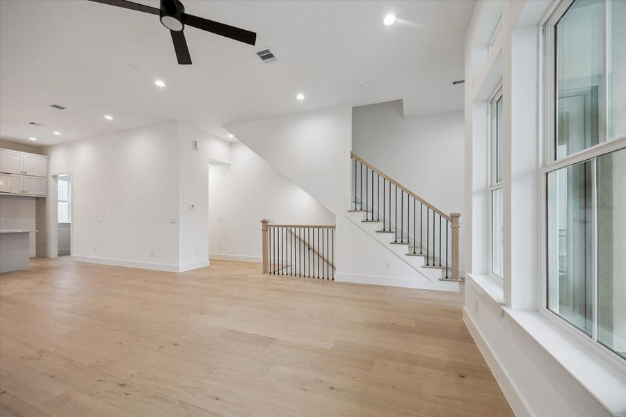 Expansive open-concept living area showcasing seamless flow between the kitchen, dining, and living spaces—perfect for entertaining.