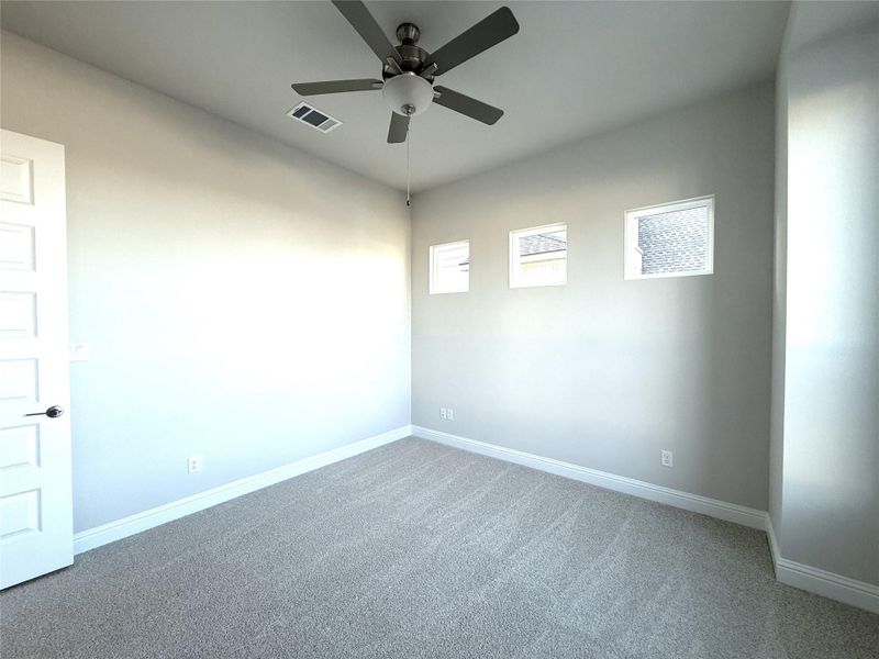 Unfurnished room with carpet floors and ceiling fan