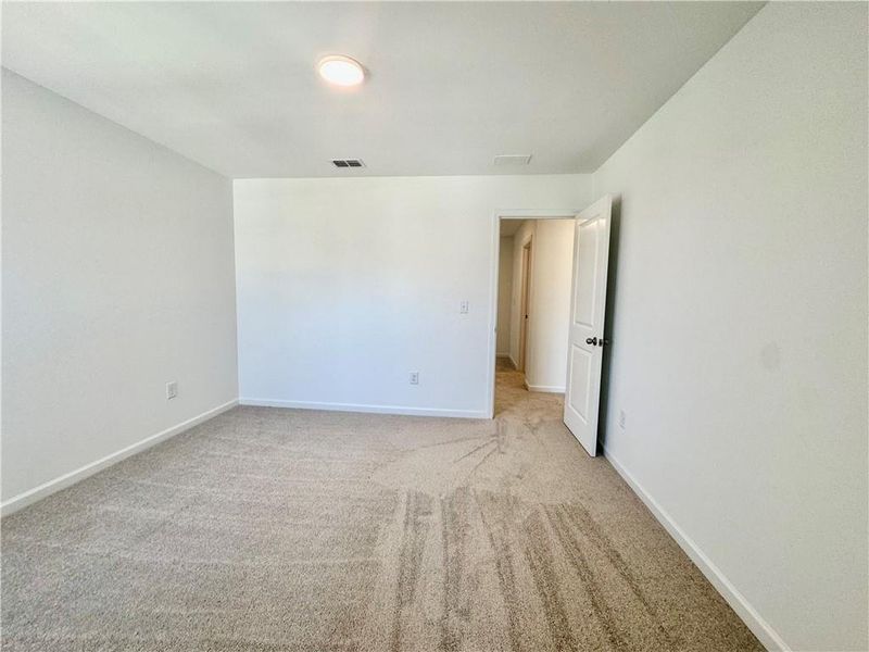 Spacious, unfurnished interior of a new home in Eastlyn Crossing, Flowery Branch (Image 24).