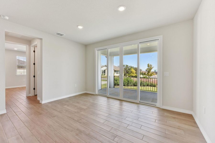 Unfurnished room with recessed lighting, light wood-style flooring, and a smoke detector