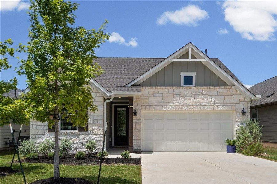 Front exterior of a new home in , Dripping Springs, TX, highlighting curb appeal (Image 24). Front exterior of a new home in , Dripping Springs, TX, highlighting curb appeal (Image 24).