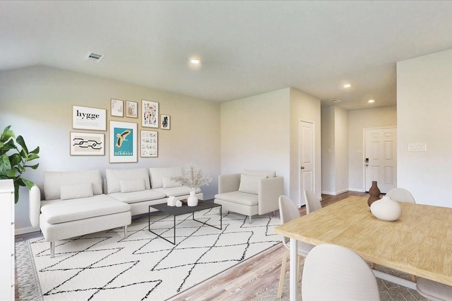 A living room with a large table and chairs. A living room with a large table and chairs.