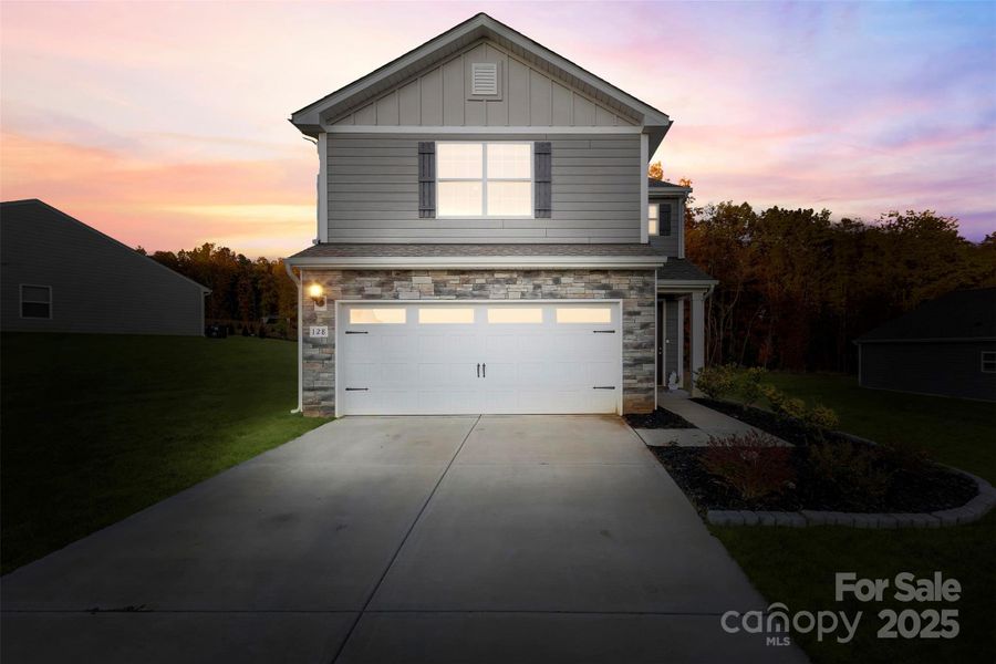 Front exterior of a new home in , Troutman, NC, highlighting curb appeal (Image 1).