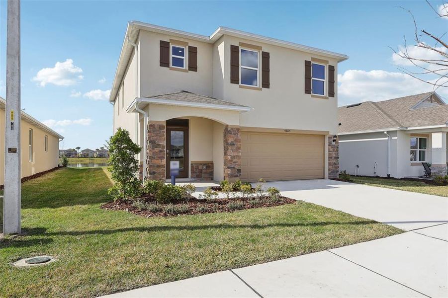 Front exterior of a new home in , Lake Hamilton, FL, highlighting curb appeal (Image 27).
