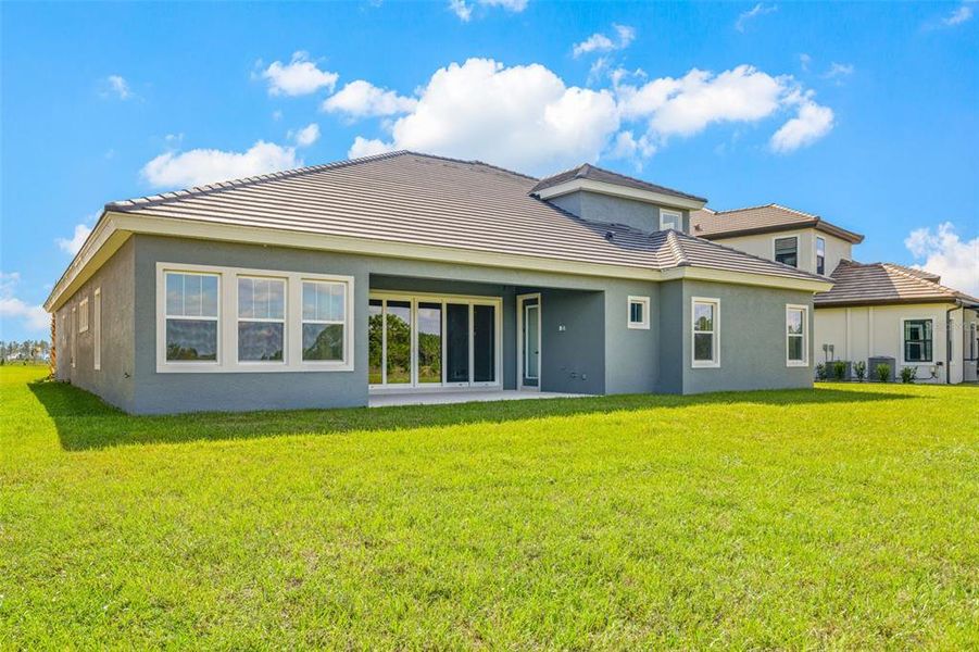Exterior details and patio area of a home in , Zephyrhills (Image 2).