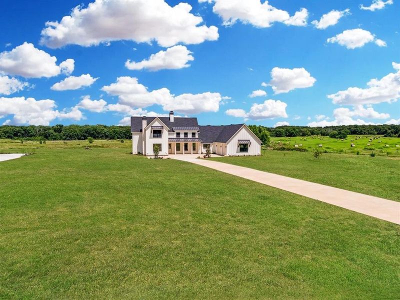 Front exterior of a new home in , Wills Point, TX, highlighting curb appeal (Image 25).