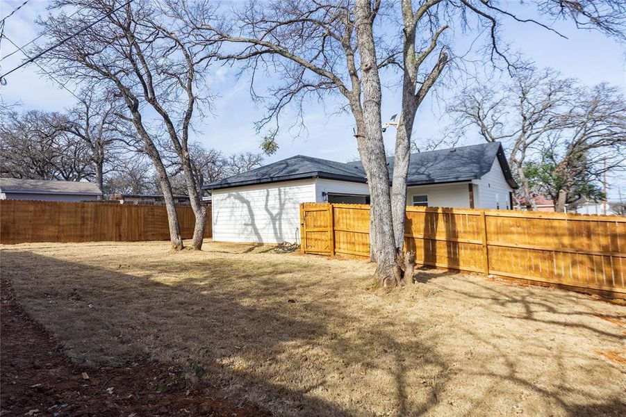 View of fenced backyard