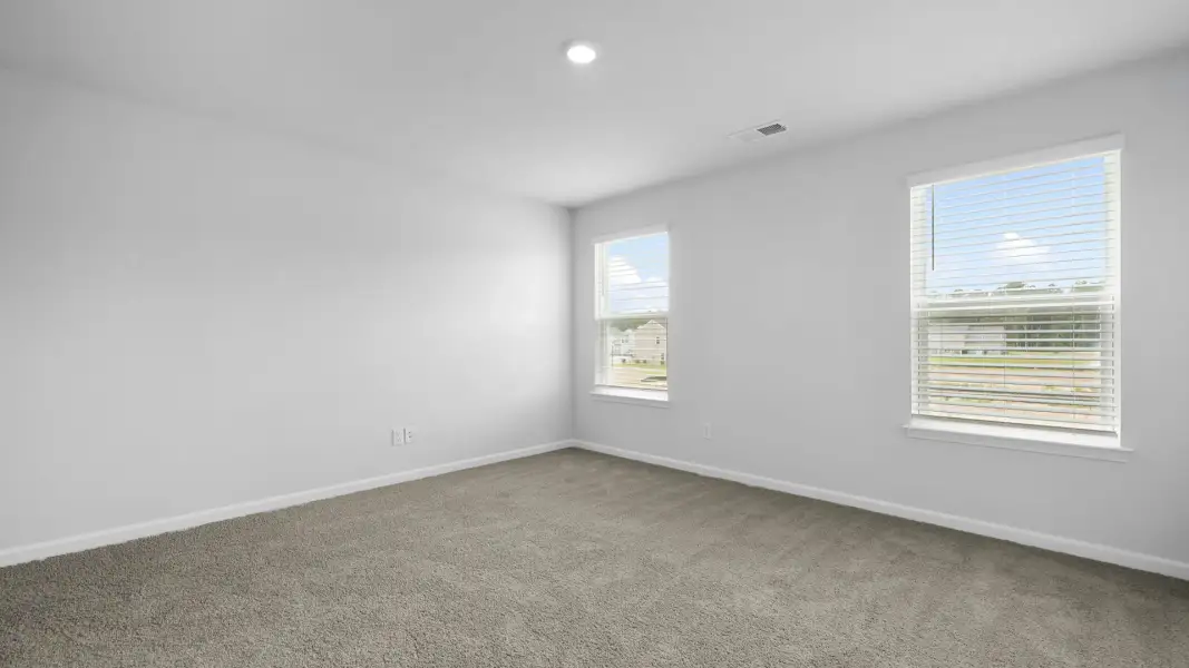 Spacious, unfurnished interior of a new home in Pine Hills Townhomes at Cane Bay, Summerville (Image 29). Spacious, unfurnished interior of a new home in Pine Hills Townhomes at Cane Bay, Summerville (Image 29).