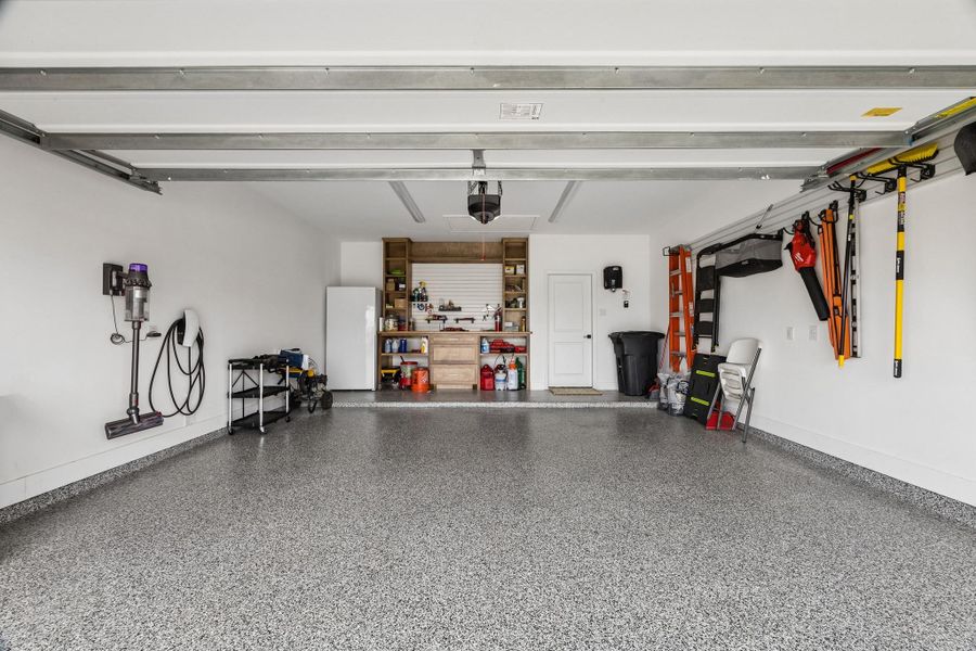 The ulimate garage upgrade features epoxy-coated floors, a solid wood workbench, slat-wall storage orgainzation, and ample space for projects, hobbies and vehicles. The ulimate garage upgrade features epoxy-coated floors, a solid wood workbench, slat-wall storage orgainzation, and ample space for projects, hobbies and vehicles.