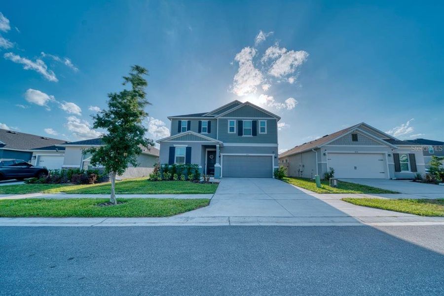 Front exterior of a new home in , Davenport, FL, highlighting curb appeal (Image 28). Front exterior of a new home in , Davenport, FL, highlighting curb appeal (Image 28).