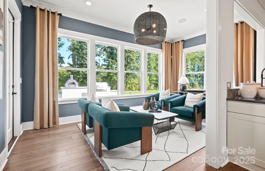 Light Filled Sunroom off of Cafe and Kitchen.  Representative Photo.