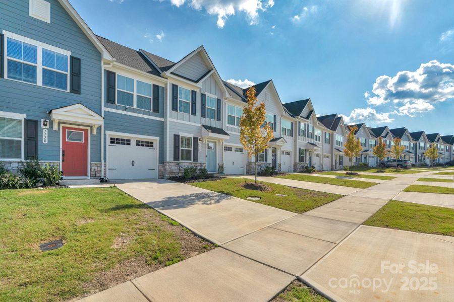 Front exterior of a new home in , Troutman, NC, highlighting curb appeal (Image 29).