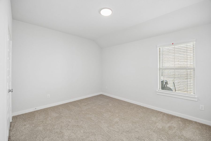 Bedroom in the Oscar home plan by Trophy Signature Homes – REPRESENTATIVE PHOTO