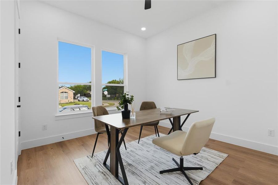 Home office with light wood-style flooring, a ceiling fan, and recessed lighting