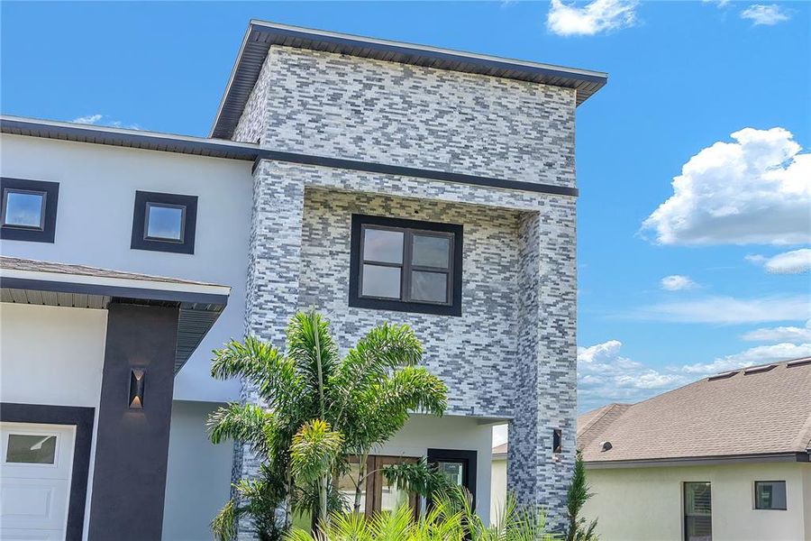 Front exterior of a new home in , Lake Alfred, FL, highlighting curb appeal (Image 25).