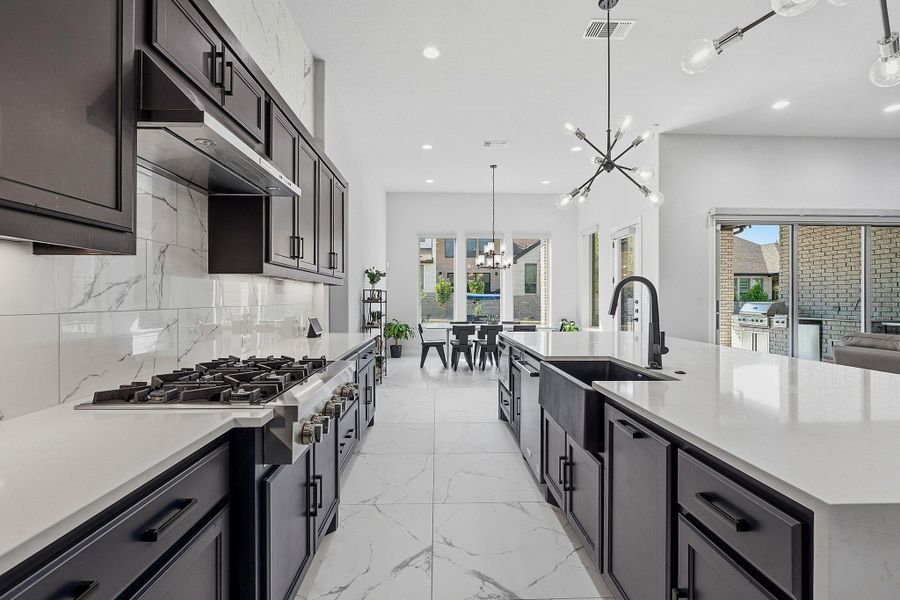 Culinary excellence awaits in this well-appointed kitchen with sleek countertops and integrated appliances. Culinary excellence awaits in this well-appointed kitchen with sleek countertops and integrated appliances.