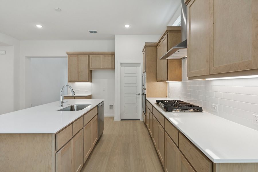 Kitchen in the Monet II home plan by Trophy Signature Homes – REPRESENTATIVE PHOTO Kitchen in the Monet II home plan by Trophy Signature Homes – REPRESENTATIVE PHOTO