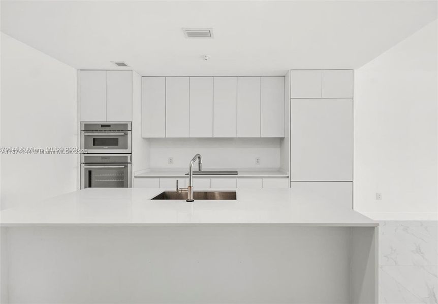 Furnished interior view inside a new home in Aria Reserve, Miami (Image 11).