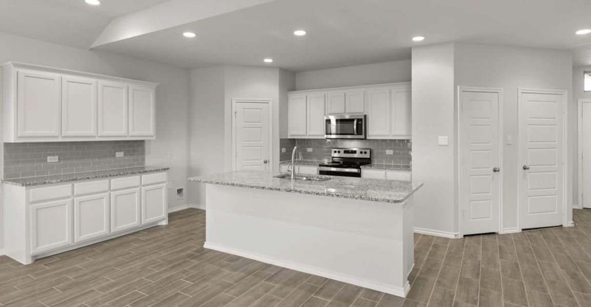 Representative exterior photo of a completed home built from the Raleigh by Impression Homes in Baker Farms, Cleburne, TX (Image 5).