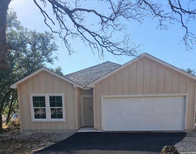 Front exterior of a new home in , Spring Branch, TX, highlighting curb appeal (Image 1). Front exterior of a new home in , Spring Branch, TX, highlighting curb appeal (Image 1).