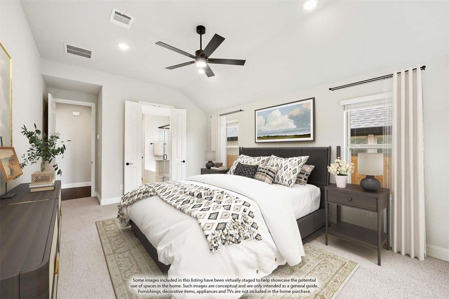 Master bedroom with vaulted ceiling, ceiling fan, carpet flooring, and doors leading to walk-in closet and bathroom Master bedroom with vaulted ceiling, ceiling fan, carpet flooring, and doors leading to walk-in closet and bathroom