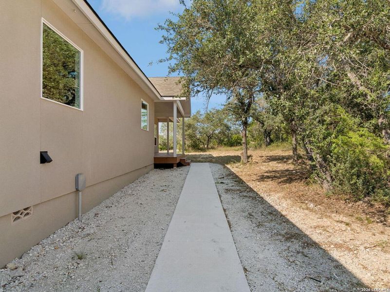 Exterior details and patio area of a home in , Spring Branch (Image 32).