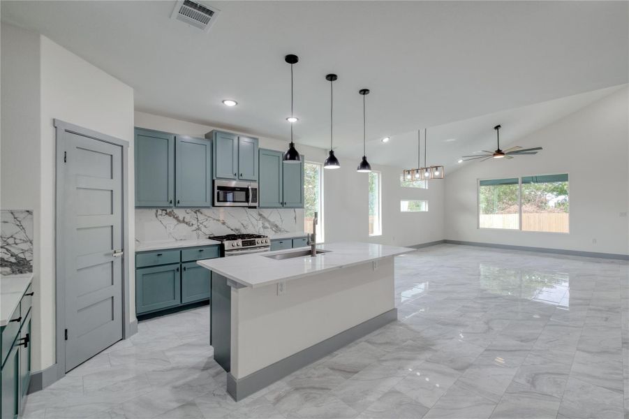 Open concept kitchen with island bar seating Open concept kitchen with island bar seating