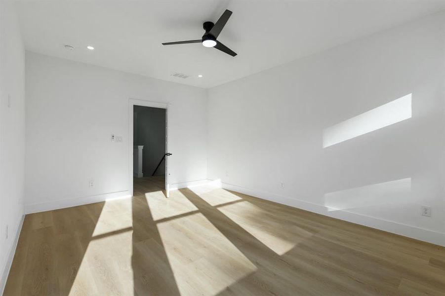 Spare room featuring light hardwood / wood-style flooring and ceiling fan