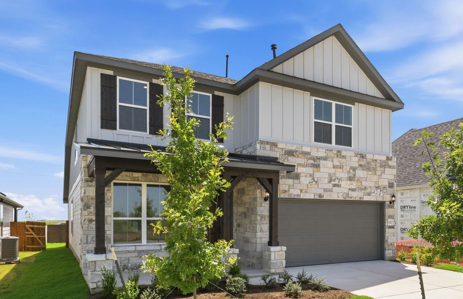Front exterior of a new home in Kuempel Farms, Pflugerville, TX, highlighting curb appeal (Image 21).
