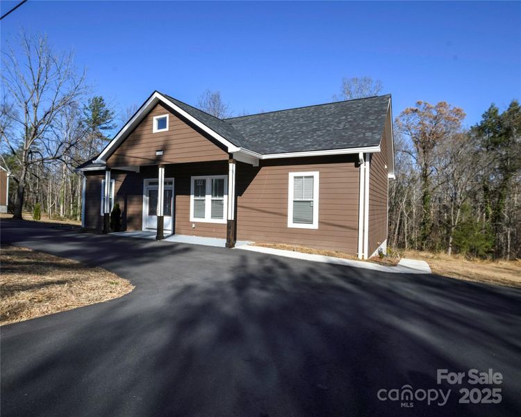 Front exterior of a new home in , Lenoir, NC, highlighting curb appeal (Image 16).