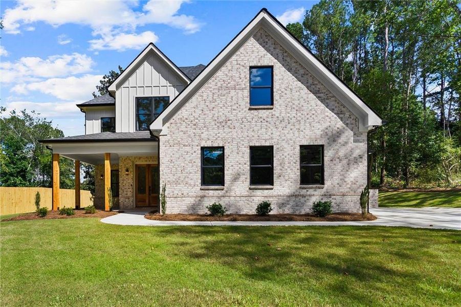 Front exterior of a new home in , Winder, GA, highlighting curb appeal (Image 29). Front exterior of a new home in , Winder, GA, highlighting curb appeal (Image 29).