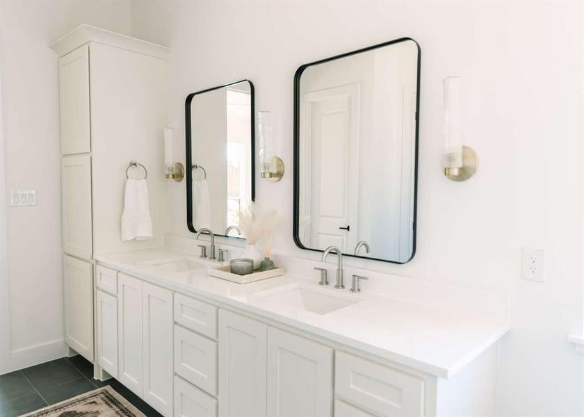 Bathroom with vanity and tile patterned flooring