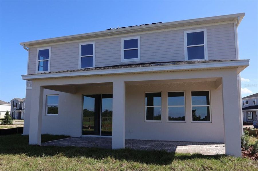 Exterior details and patio area of a home in Bay Lake Farms, St. Cloud (Image 3).