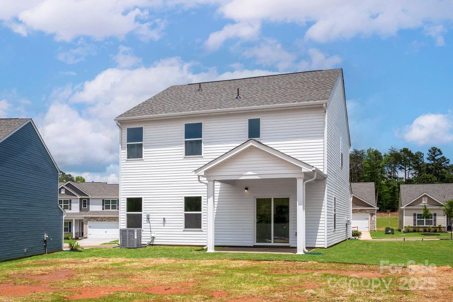 Front exterior of a new home in Ascot Woods, Charlotte, NC, highlighting curb appeal (Image 1).