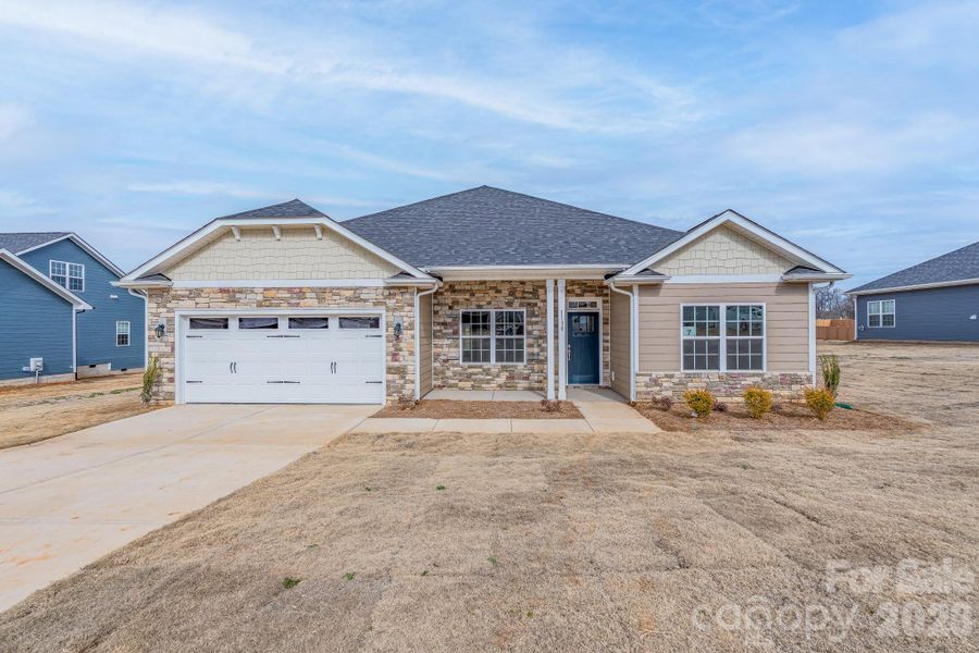 Front exterior of a new home in McNeely Farms, Mount Ulla, NC, highlighting curb appeal (Image 14).