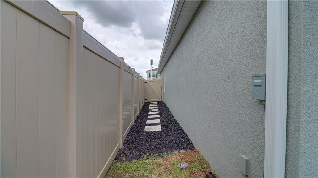 Exterior details and patio area of a home in Epperson, Wesley Chapel (Image 15).