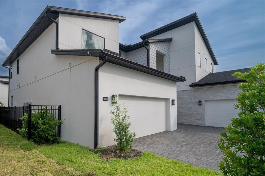 Front exterior of a new home in , Orlando, FL, highlighting curb appeal (Image 17).