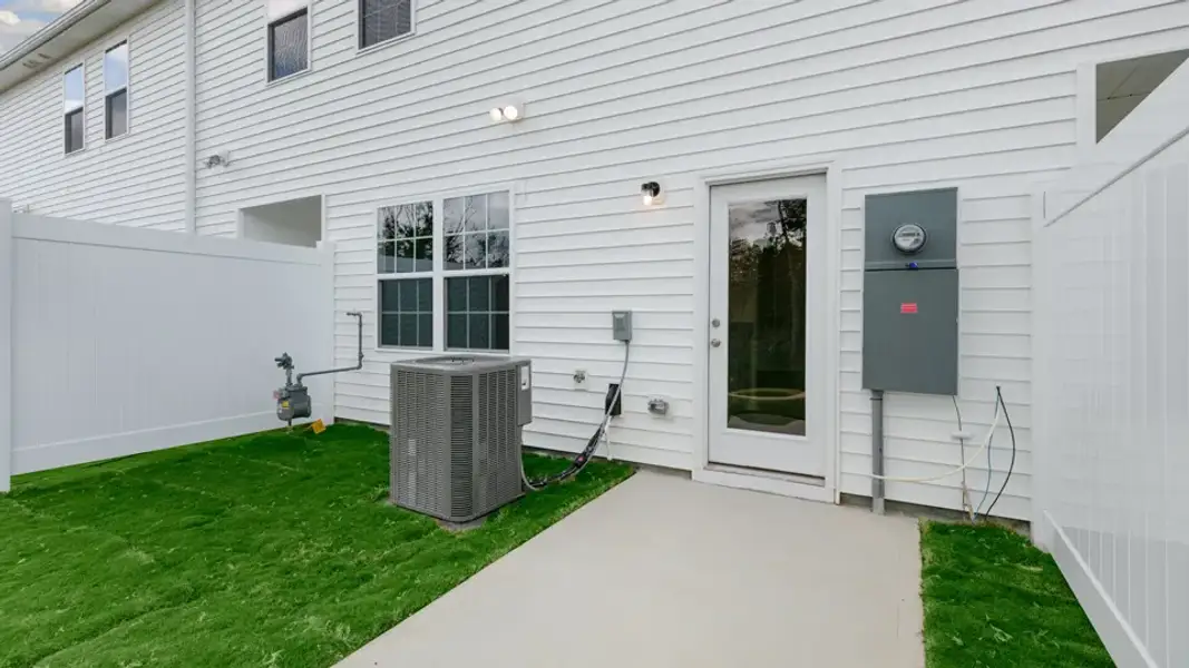 Exterior details and patio area of a home in The Townes at Galvins Ridge, Sanford (Image 4).