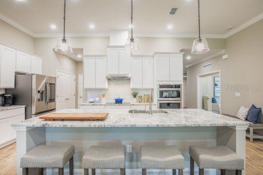 Furnished interior view inside a new home in Heritage Station, Punta Gorda (Image 15).