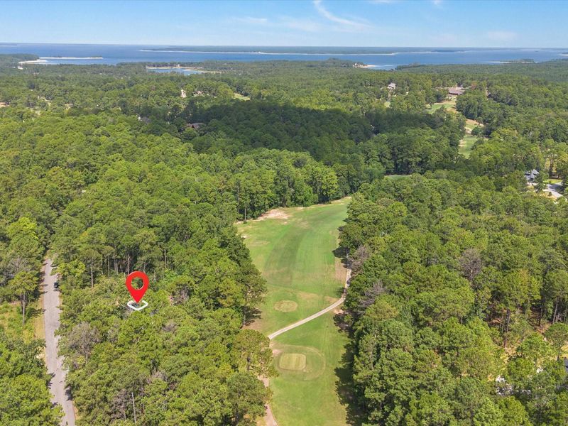 Tucked privately into a natural wooded shelter, the property is a recreational outdoorsman's paradise, offering golfing and fishing just minutes away
