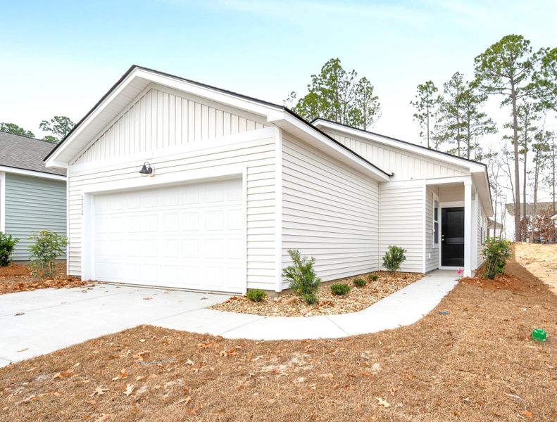 Front exterior of a new home in Grand Arbor, Blythewood, SC, highlighting curb appeal (Image 15).