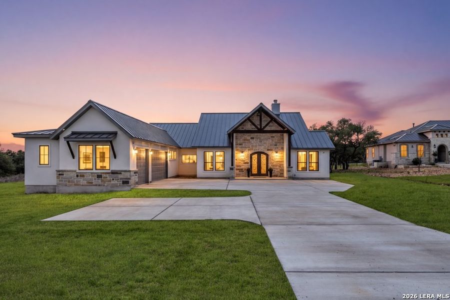 Front exterior of a new home in , Bulverde, TX, highlighting curb appeal (Image 28).