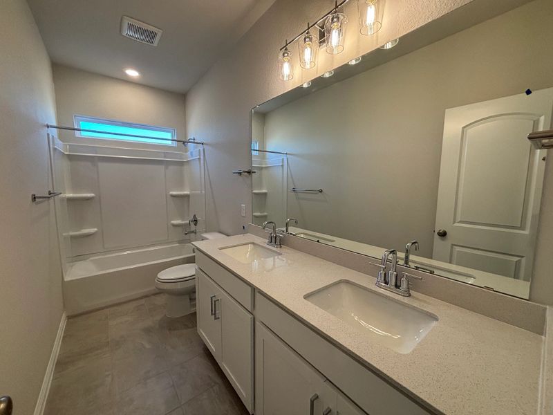 Furnished interior view inside a new home in Cannon Ranch 40s, Dripping Springs (Image 11).