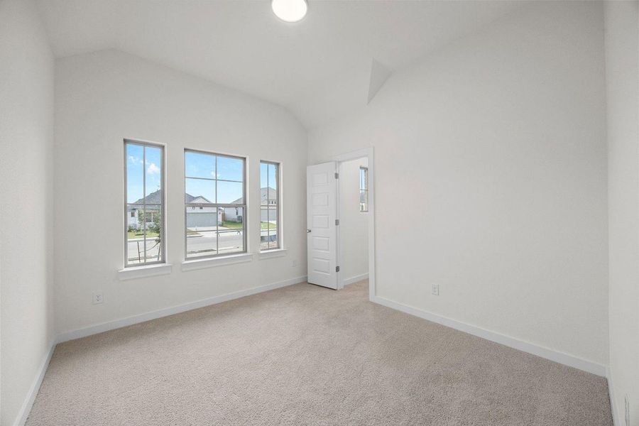 Bedroom in the Sabine home plan by Trophy Signature Homes – REPRESENTATIVE PHOTO